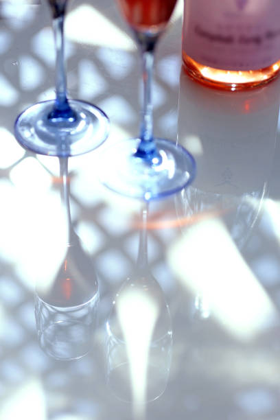 istock Rose wine poured into a glass, light and shadow 1415112889