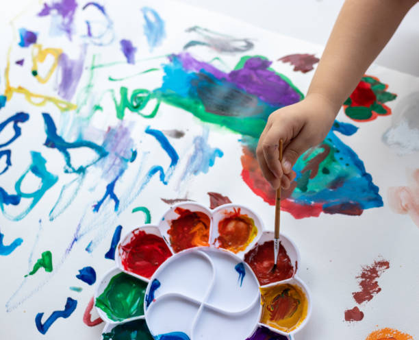 istock Child paint with watercolors. Education concept. 1415117816