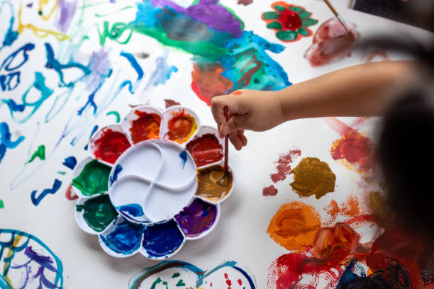 istock Child paint with watercolors. Education concept. 1415117820