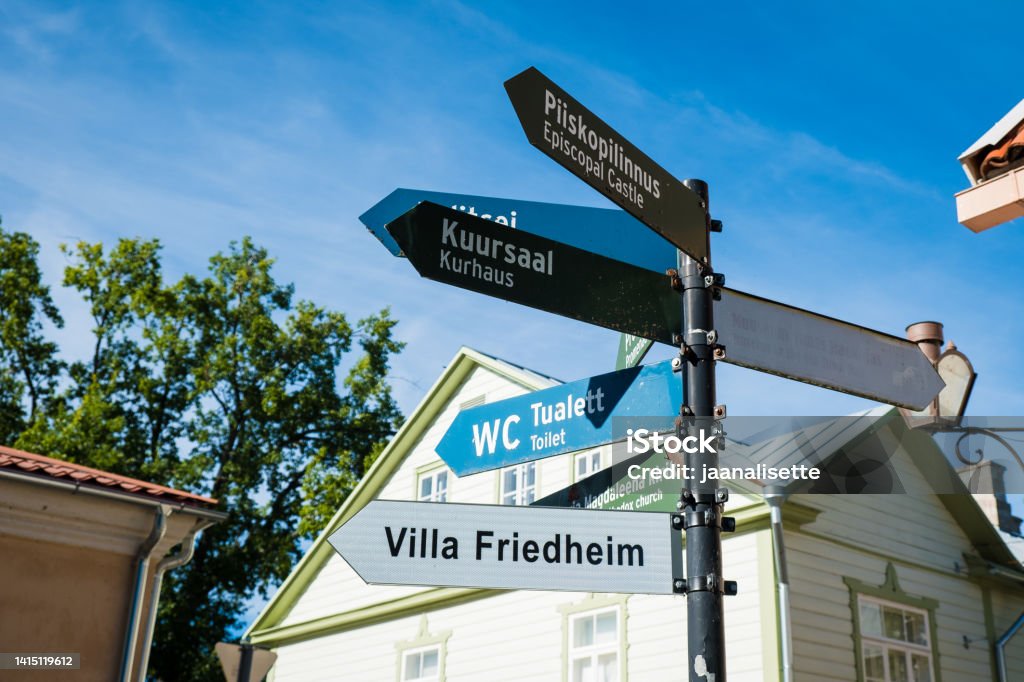 Travel information signpost for Haapsalu visitors. Sign pointing to different sights and tourist attractions in Haapsalu, Estonia. Arrow Symbol Stock Photo