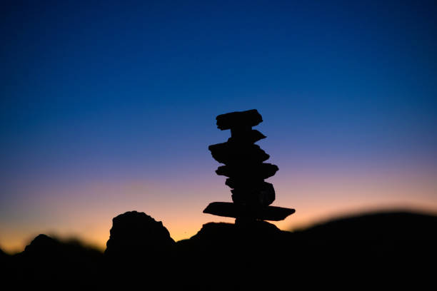 istock Silhouette Shale Rock Cairn at sunrise 1415119740