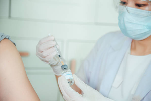 istock A doctor is injecting the monkeypox vaccine into the patient. 1415122987
