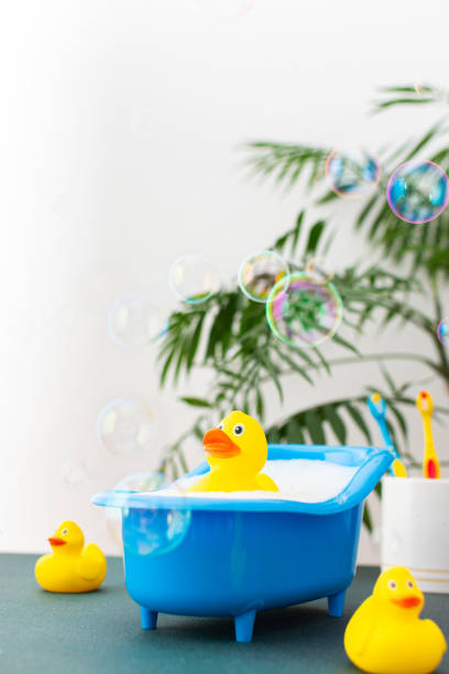 istock Duck sits in a doll bath with soap suds 1415123498