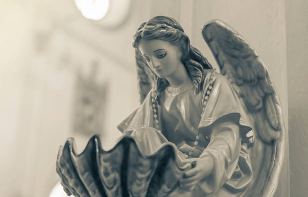 The statue of the angel on the church stock photo