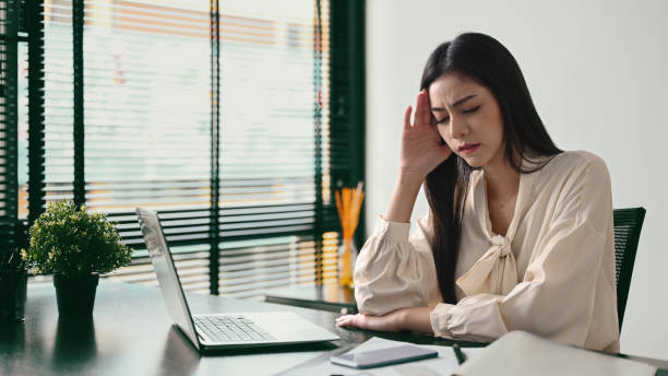 istock Stressed businesswoman thinking find solution problem of work. Emotional pressure, stress at work concept. 1415124480