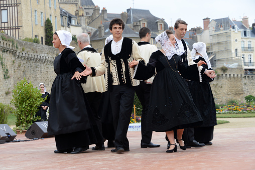 Vannes, France, August 15, 2022 : Dancers in traditional Breton costume at the Arvor festival in Vannes in Brittany