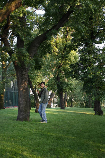 istock A happy man in the park talks on the phone 1415126840
