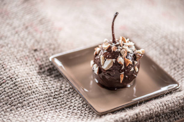 Poached Small Pears with Melted Chocolate and Almonds