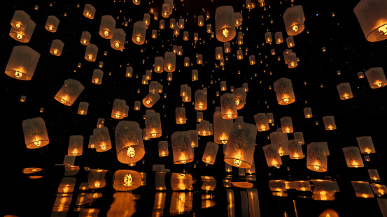 A group of beautiful sky lantern on the dark sky at night. Loy Krathong Festival, Yi Peng Festival in Thailand, Chinese flying lantern background. 3d rendering, 3d illustration