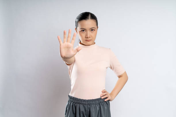 asian woman showing hand making stop sign. - announcement message mistake disappointment communication imagens e fotografias de stock