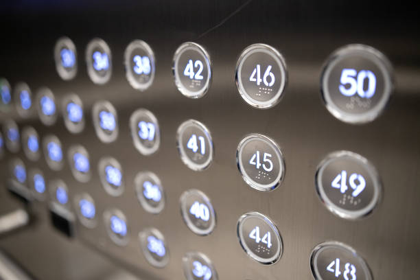Closeup of metal buttons in an elevator background stock photo