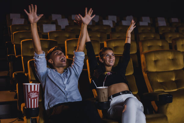 istock Caucasian white couples enjoying a movie. 1415132602