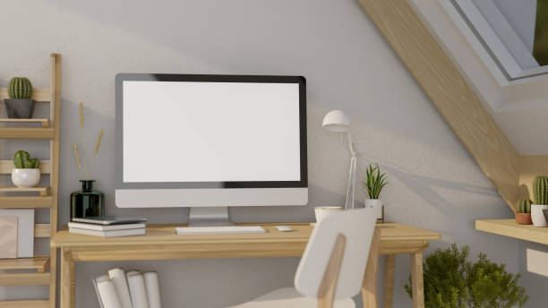 istock Minimal Scandinavian home workplace in attic room interior design with desktop computer mockup 1415134300