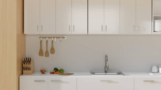 istock Modern minimal kitchen cooking space interior design with minimal white wall and base cabinets 1415134321