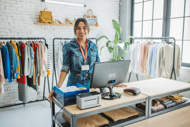 Sustainable shopping Ethnic small business owner smiling cheerfully in her shop. saleswoman photos stock pictures, royalty-free photos & images