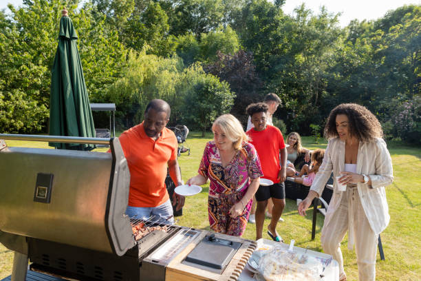 istock Family Digging into the Barbecue 1415136124
