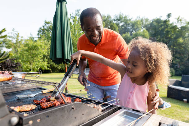 istock Granddaughter Learning To Cook 1415136151