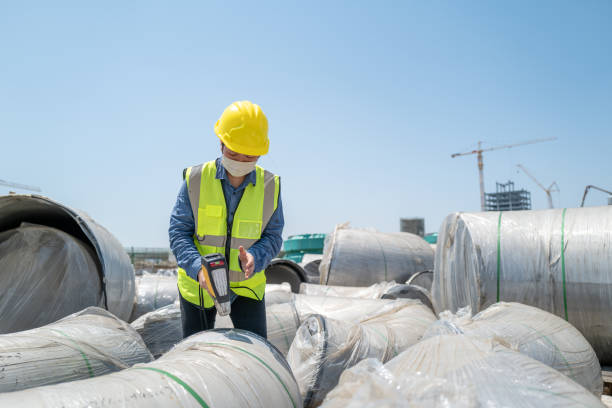 istock A female engineer wearing a mask was testing  on the construction site with an instrument 1415138948