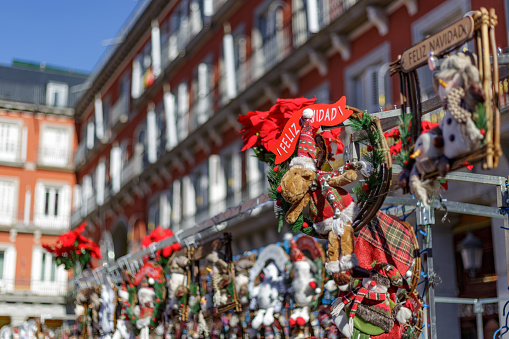 Madrid, Spain. December 3, 2021. Stuffed animals and Christmas motifs at the market of plaza mayor in dates before Christmas