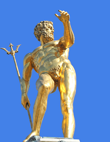 Golden Statue of Neptune with blue sky background in Batumi,Georgia