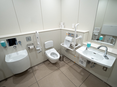 Thoughtful design of a disabled toilet, a folding chairs in toilet for the disabled