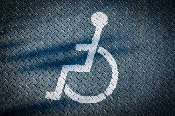 Disabled Ramp - Help Call Button. A button to call personnel to help people with disabilities at the entrance to the building. Side view. Selective focus. Outdoors.