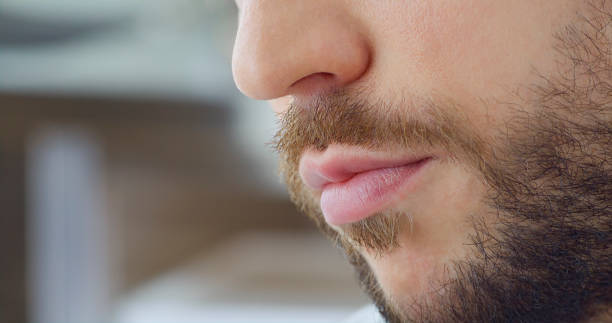 istock Beard and pink lips of young man 1415144124