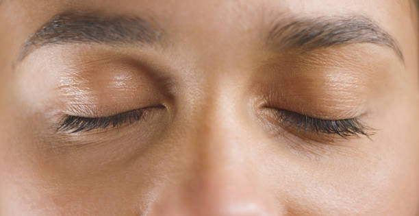 istock Woman with eyes closed 1415144131
