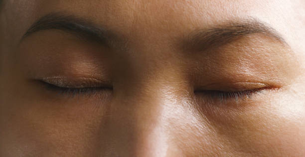 istock Woman with eyes closed 1415144211