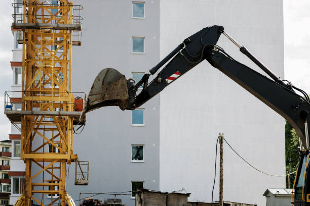 istock Excavator with bucket lift 1415145403