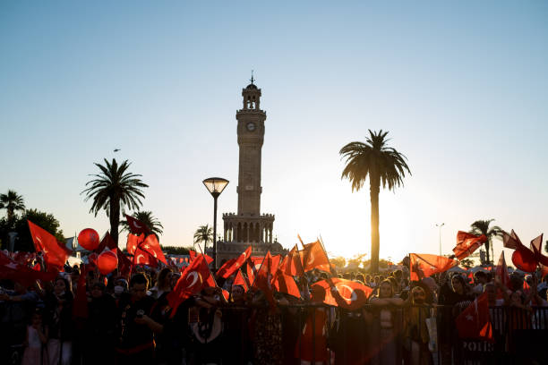 Celebrations of 15 July Democracy day of Turkey. Izmir, Turkey - July 15, 2022: Celebrations of July 15 Day of Democracy in Turkey Izmir. People holding Turkish flags at Konak square in Izmir and in front of the historical clock tower. izmir stock pictures, royalty-free photos & images