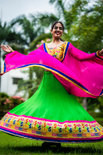 Beautiful Indian woman in traditional chaniya choli for navratri. Navratri is an Indian Festival and Chaniya choli its traditional costume