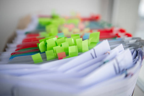 istock Pile of unfinished documents on office desk, Stack of business paper 1415151764