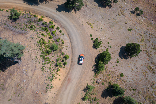 Potash , Ut: Toyota 4runner SUV (2016 trail edition) with a whitewater kayak on roof racks in the Colorado RIver canyoin near Moab.