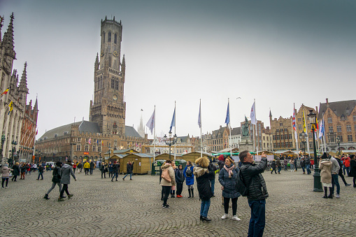 BRUGES BELGIUM ON NOVEMBER 25, 2018: Christmas square Grote Markt with Christmas market and ice rink  in Bruges.
