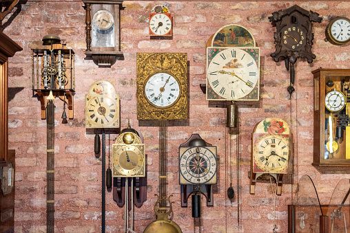 Time concept with old wall clocks