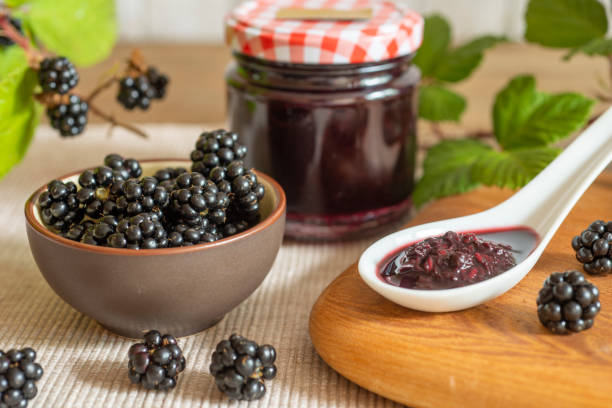 istock Blackberries in basket with blackberry jam or jelly 1415156010