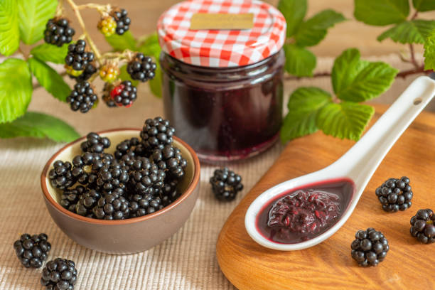 istock Blackberries in basket with blackberry jam or jelly 1415156481