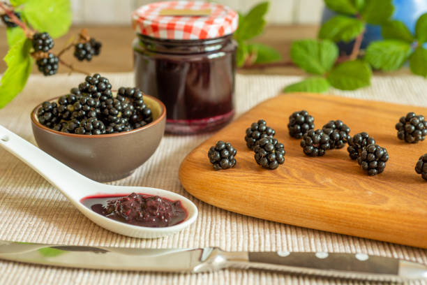 istock Blackberries in basket with blackberry jam or jelly 1415156766