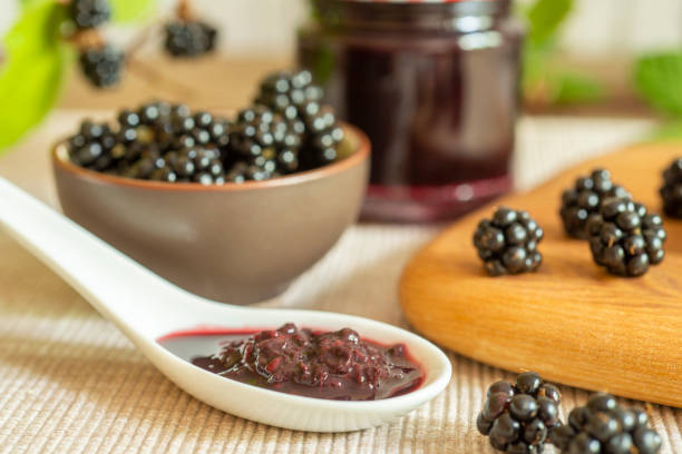 istock Blackberries in basket with blackberry jam or jelly 1415159741