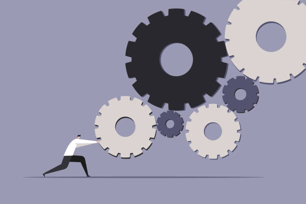 istock Illustration of a businessman turning the cog wheels 1415159846