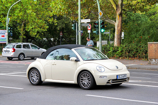 Berlin, Germany - September 11, 2013: Urban convertible car Volkswagen New Beetle in the city street.