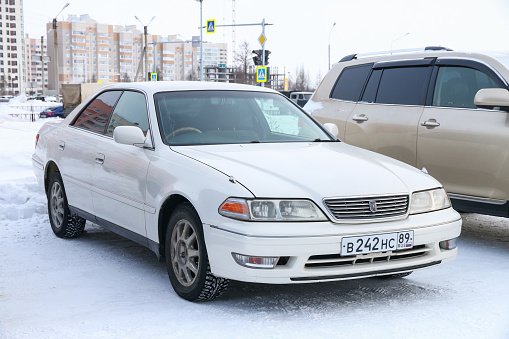 Novyy Urengoy, Russia - March 3, 2019: Old Japanese sedan Toyota Mark II (X100) in the city street.