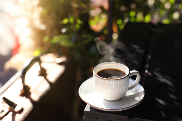istock Cup of hot aromatic coffee on table in outdoor cafe. Space for text 1415161923