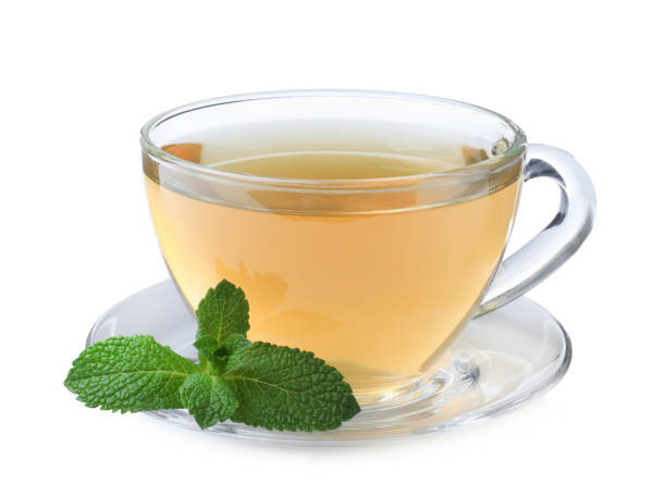 istock Cup of aromatic green tea with fresh mint on white background 1415162193