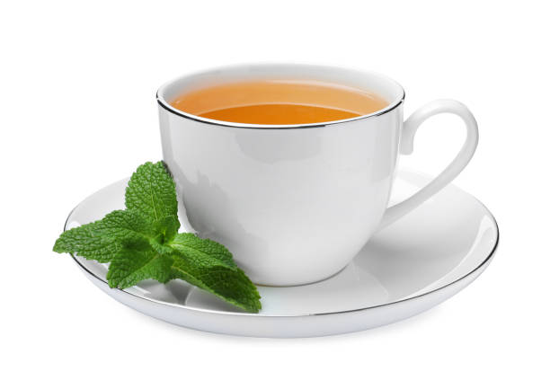 istock Cup of aromatic green tea with fresh mint on white background 1415162265