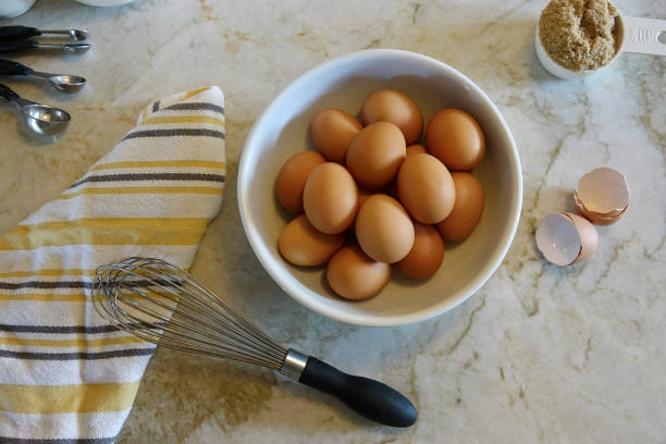 istock Brown eggs in a white bowl on the counter top 1415166451
