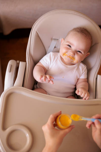 istock Mother feeding baby boy 1415167208