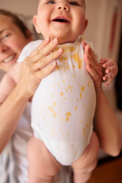 istock Mother holding baby after meal 1415167239