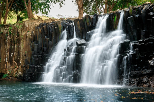 istock Scenic cascade waterfall with amazing rocks in Mauritius island 1415168067